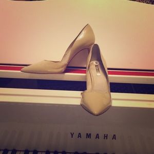 Tan patent leather heels.